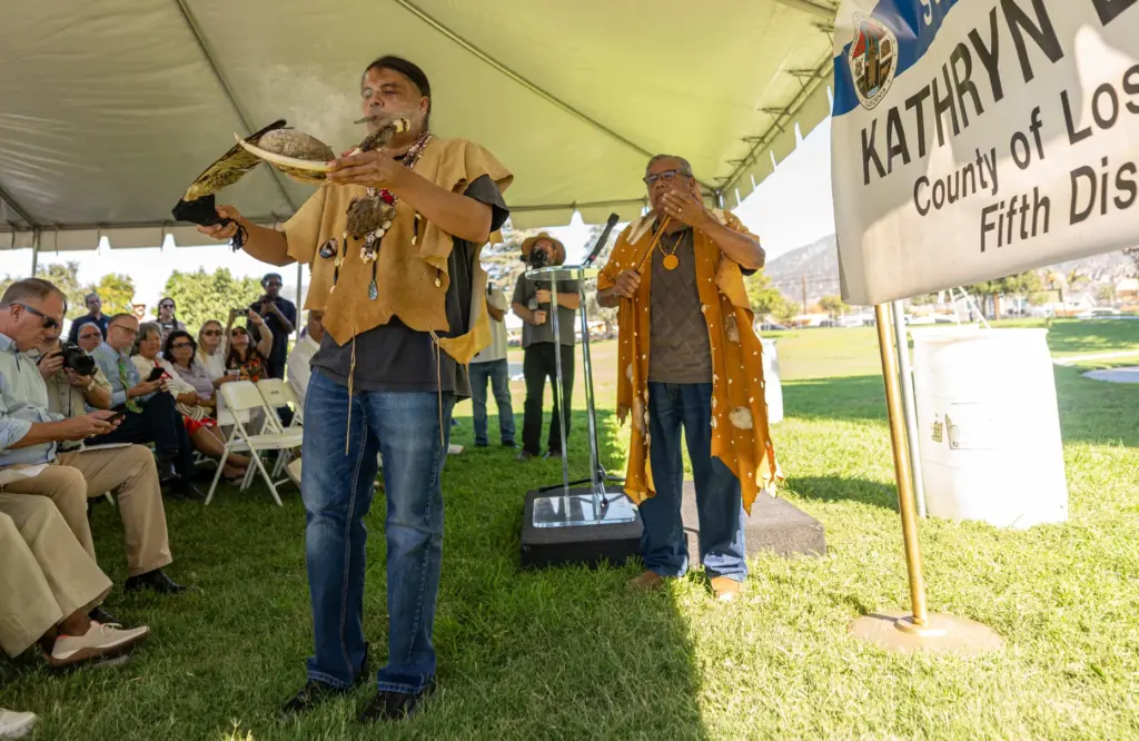 Andrew Guiding Young Cloud Morales, left, and Chief Anthony Morales...