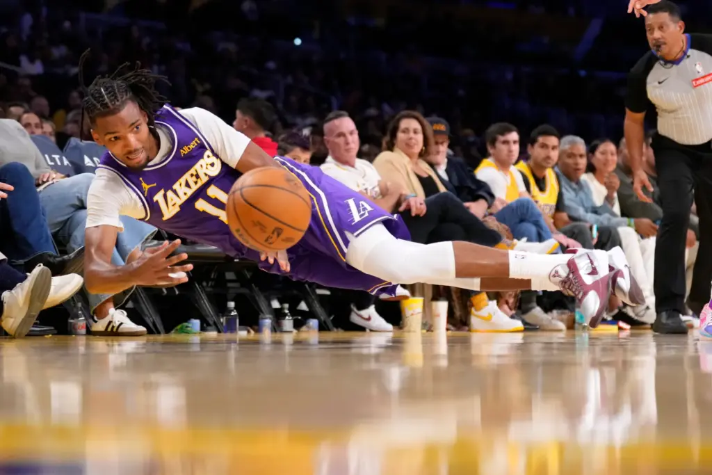 Lakers forward Ziaire Williams tries to keep a ball from...