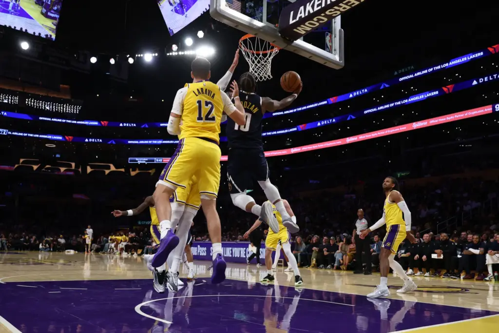 Denver Nuggets guard DeMar DeRozan (10) dunks the ball during...