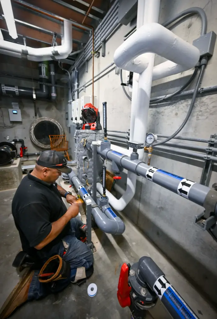 Oscar Cardenas works on the newly renovated water system at...