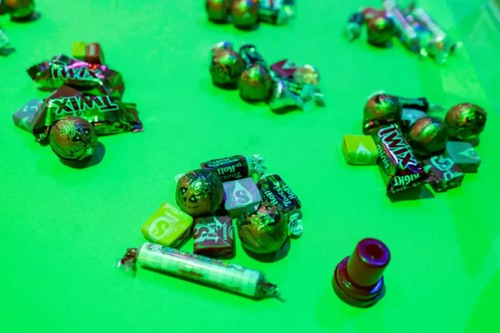 Piles of candy wait to be taken by trick-or-treaters during...