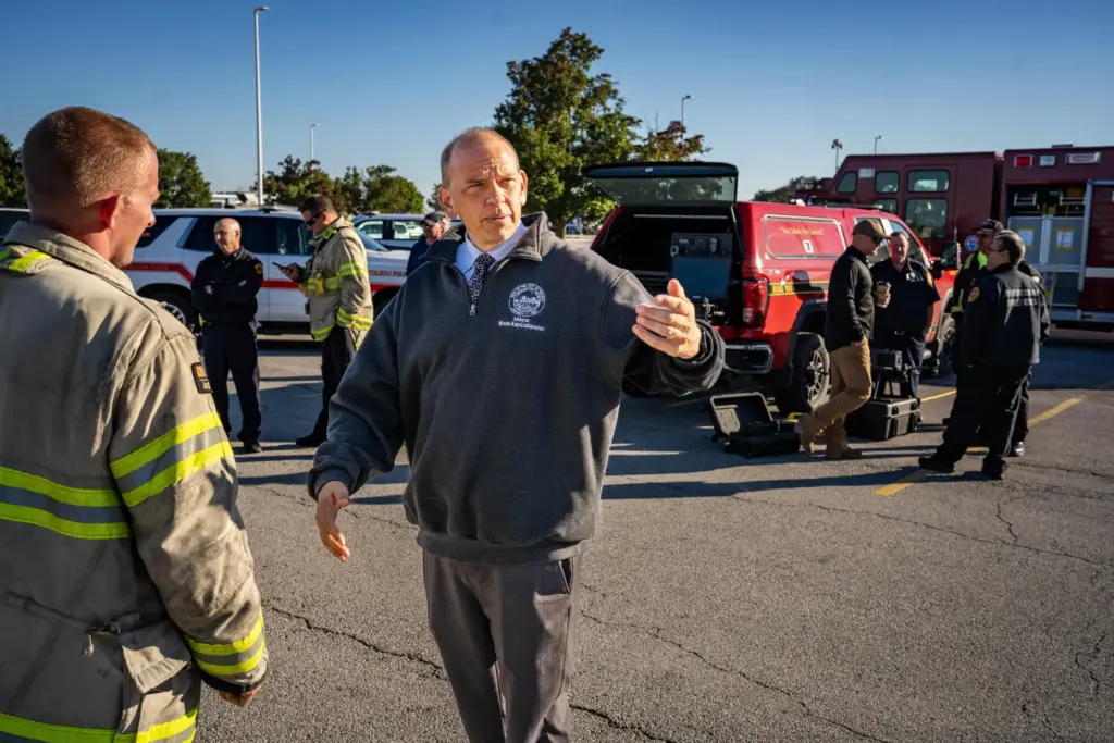 Toledo Mayor Wade Kapszukiewicz speaks with firefighters at the scene near MC Tank Transport Inc.
