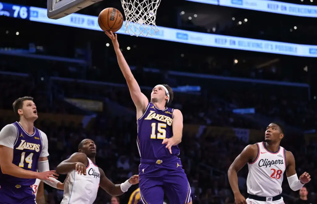Lakers guard Austin Reaves drives to the basket for a...