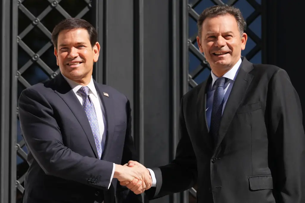 Secretary of State Marco Rubio is greeted by Portugal's Prime Minister Luis Montenegro.