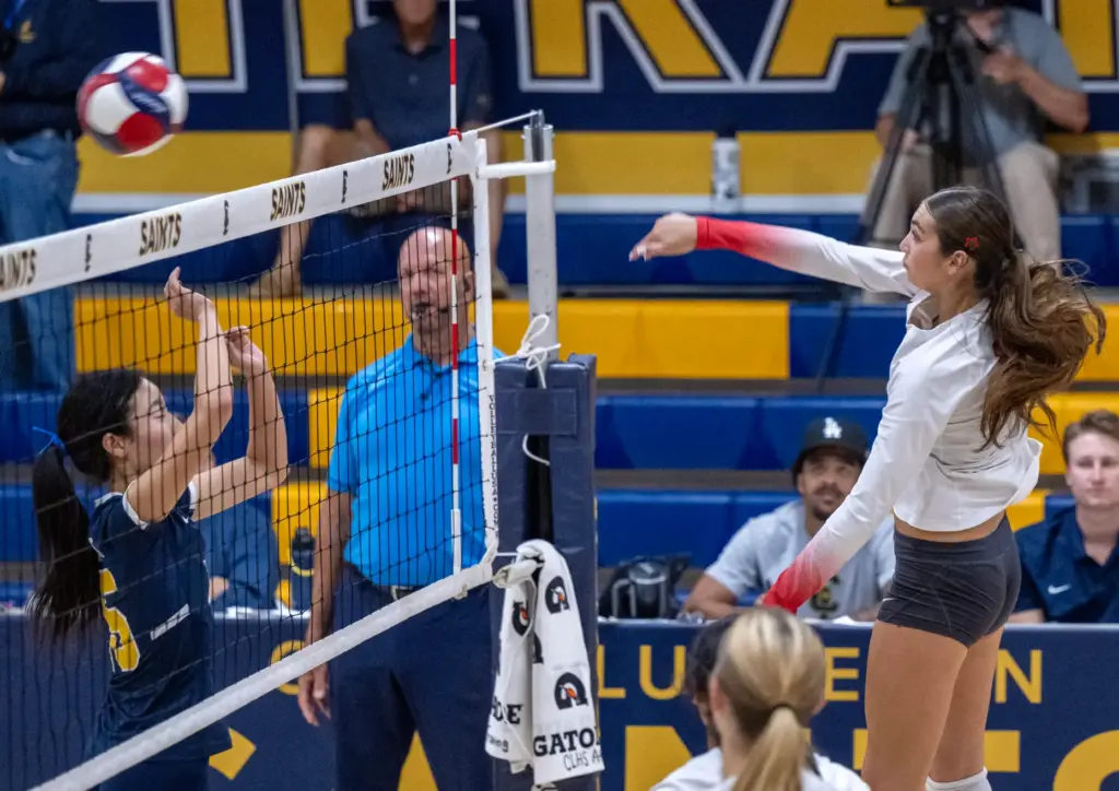 Redondo Union middle blocker Sienna Castillo (10) hits the ball...
