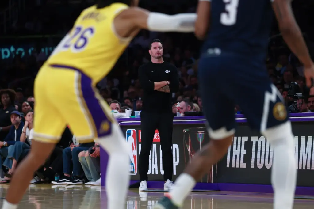 Lakers head coach JJ Redick looks on from the sideline...