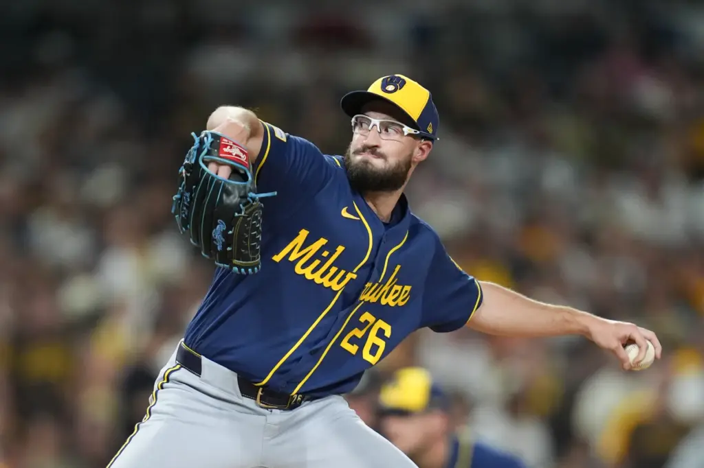 Milwaukee Brewers relief pitcher Aaron Ashby throws to the plate...