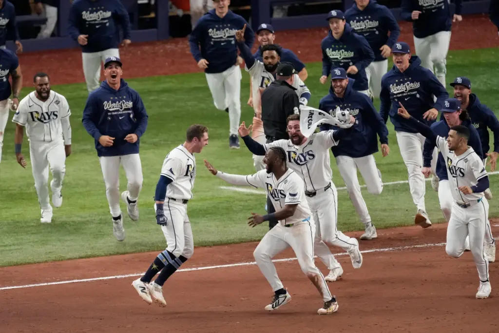 The Tampa Bay Rays’ Ben Williamson, left, celebrates with teammates...