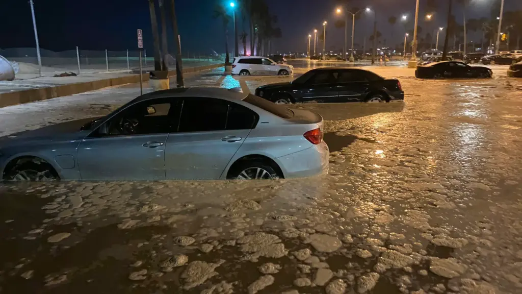 Big waves and a high tide sent ocean water flooding...