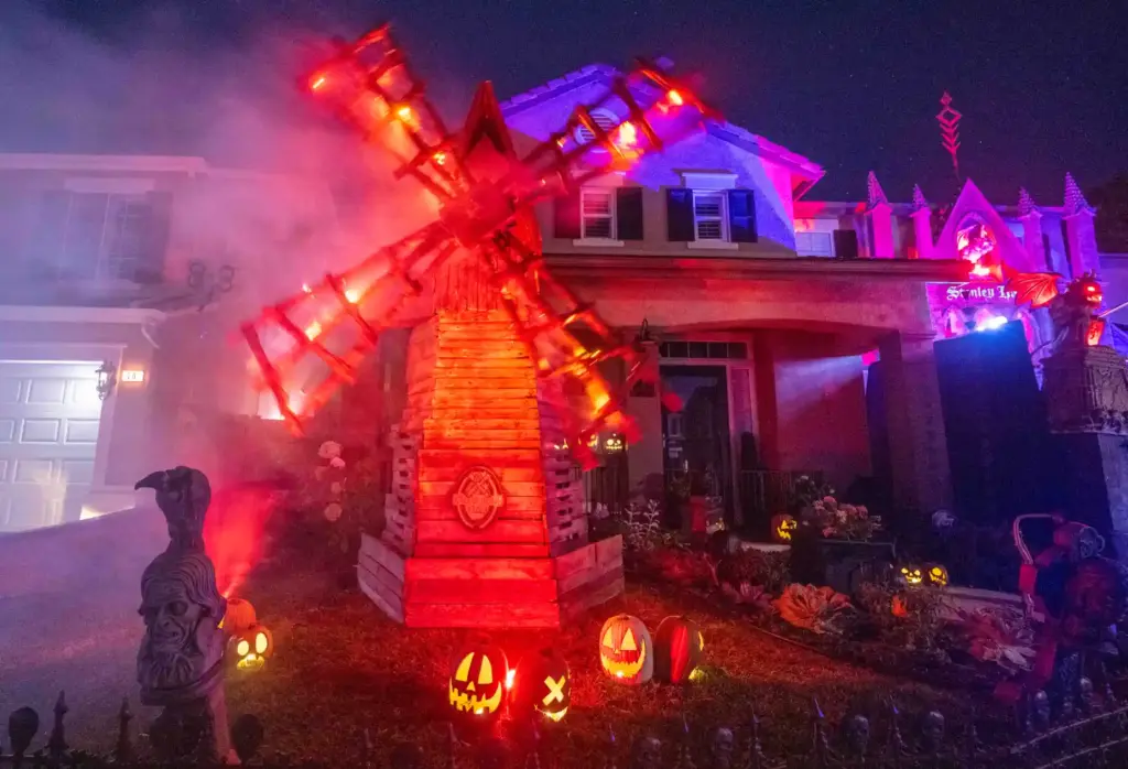 A spinning and smoking windmill is among the elaborate Halloween...