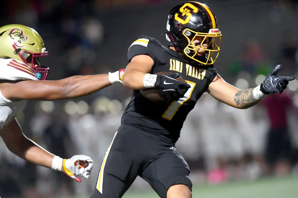 Oaks Christianâs Alifeleti Tuihalamaka tries to tackle Simi Valleyâs Salvador...