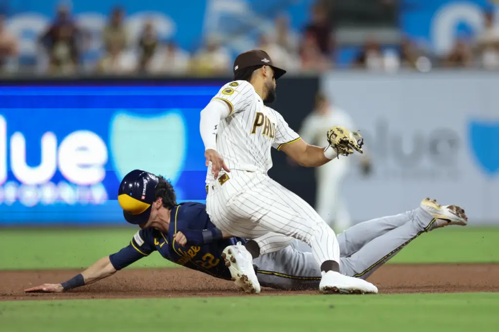 The Milwaukee Brewers’ Christian Yelich (22) steals second base against...