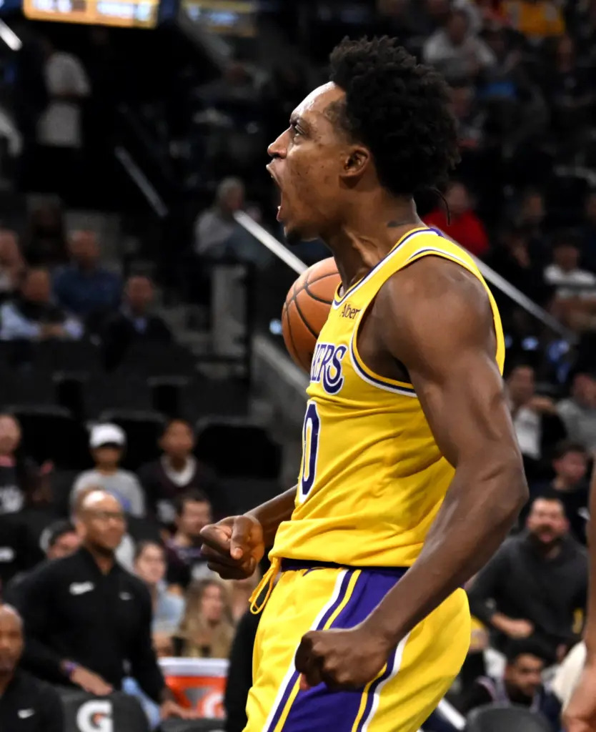 Lakers guard Collin Sexton celebrates after a basket during the...