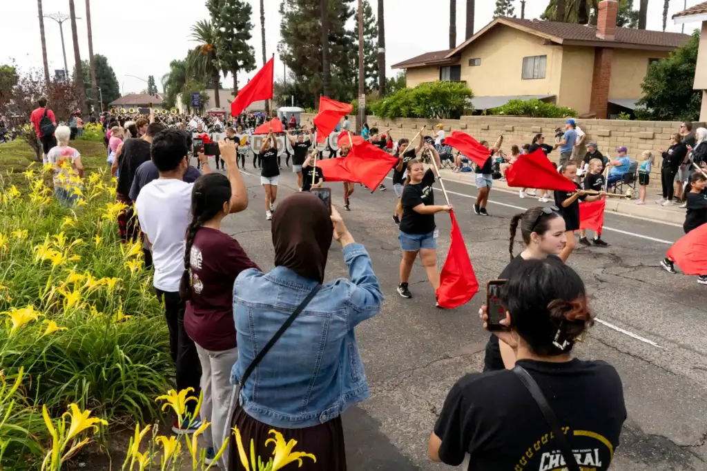 Spectators film the El Dorado Youth Guard as they perform...