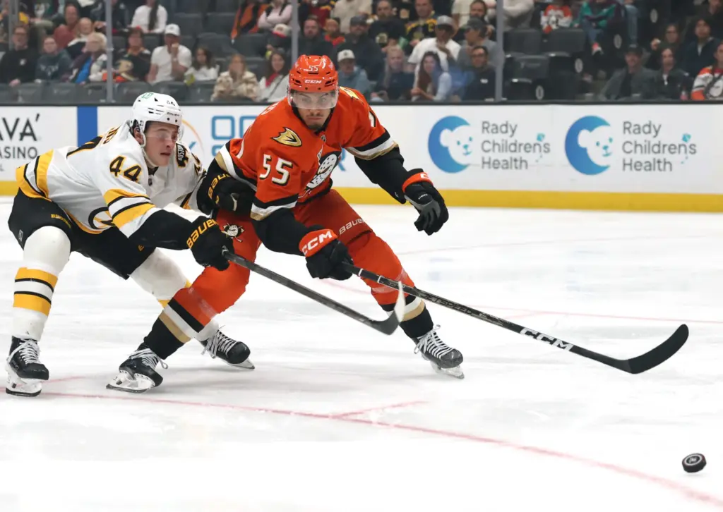 The Ducks’ Tyson Hinds, right, skates after the puck in...