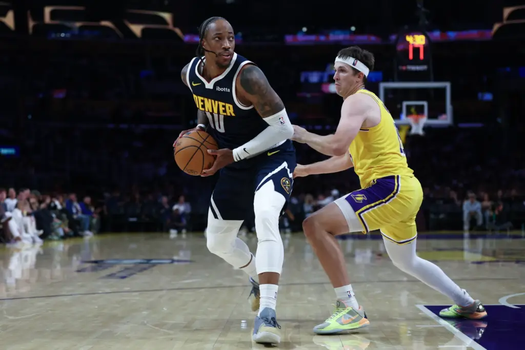 Denver Nuggets guard DeMar DeRozan makes a move to the...