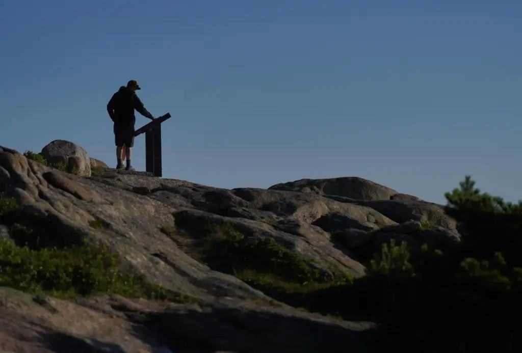 Visitors at the summit of Cadillac Mountain in Acadia National...