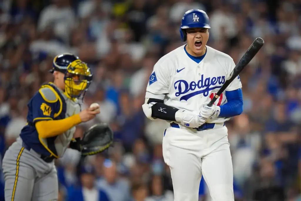 Dodgers star Shohei Ohtani reacts after drawing a walk during...