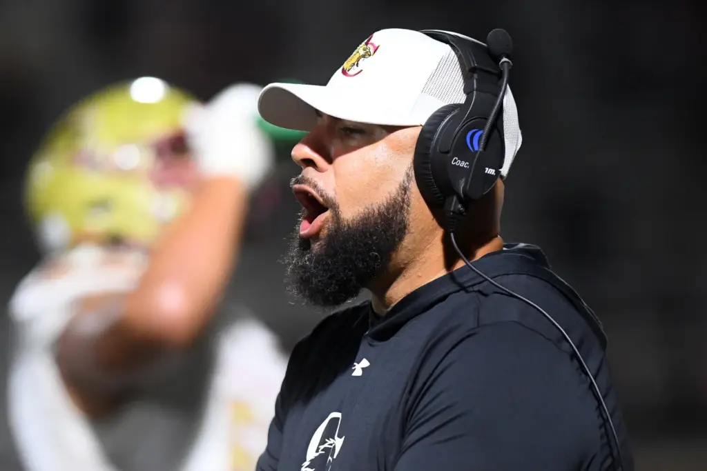 Former NFL player Hank Baskett helps coach Oaks Christian during...