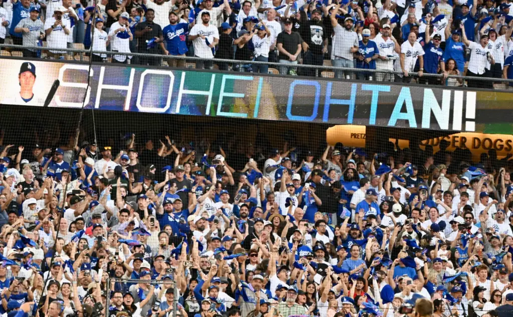 Fans celebrate after Dodgers star Shohei Ohtani hit a three-run...