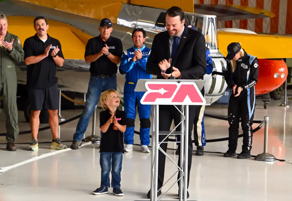 Kevin Elliott, CEO of Code Four, aided by his son,...