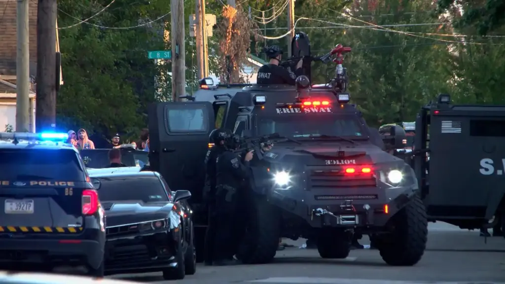 In this image from video provided by WJET, police gather...
