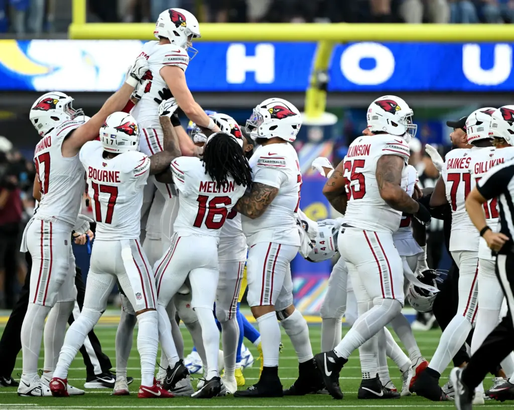 Arizona Cardinals place kicker Chad Ryland (38) gets a ride...