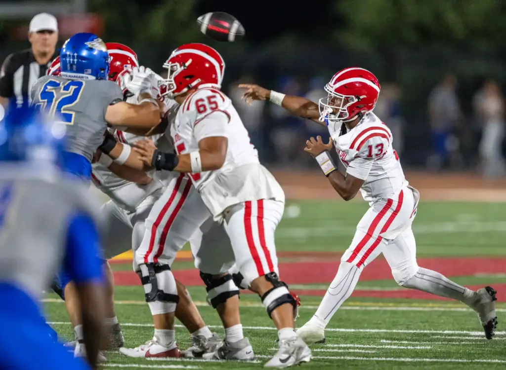 Mater Dei quarterback Paytyn Guess (13) throws the ball during...