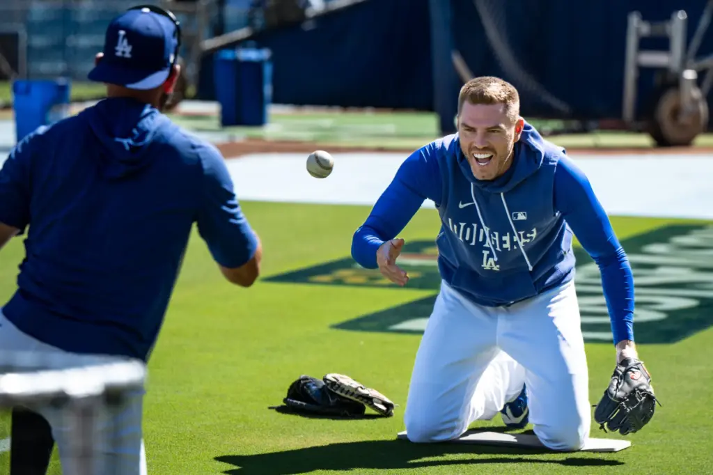 Dodgers first baseman Freddie Freeman warms up before Game 3...