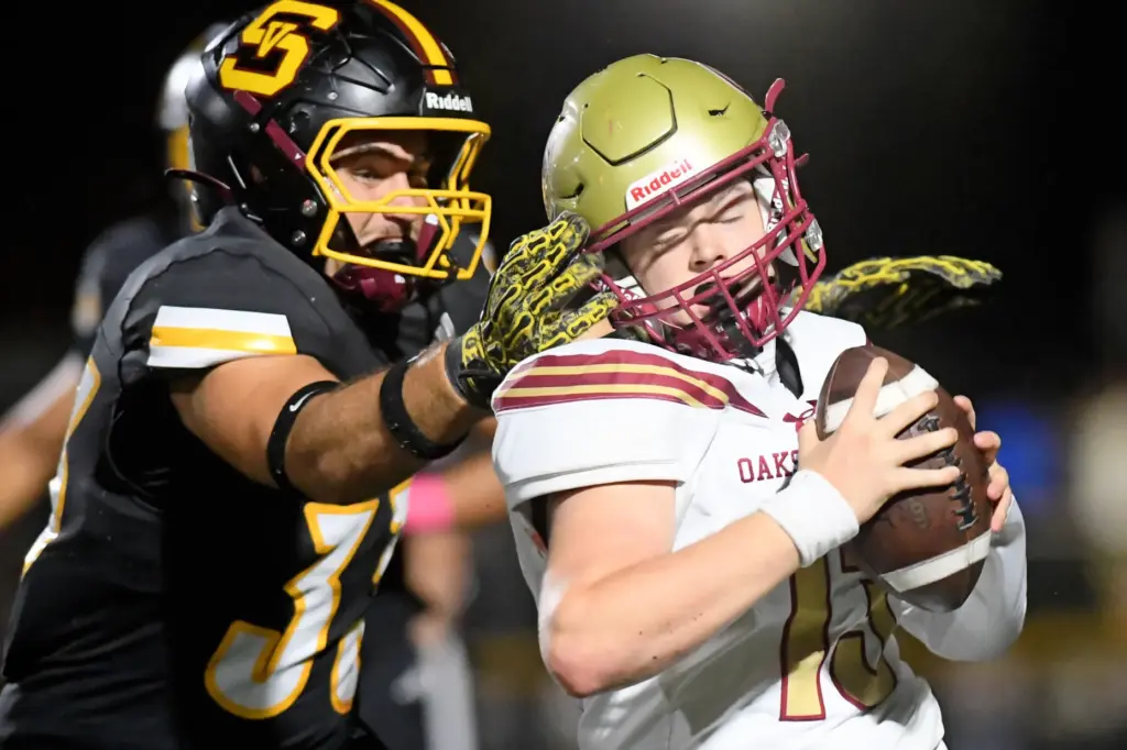 Simi Valleyâs Brody Samon tackles Oaks Christian quarterback Cody Bird...