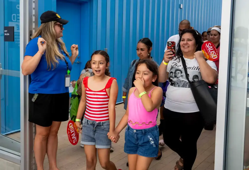 Camila Bargas and Natalie Olivares react with delight upon seeing...