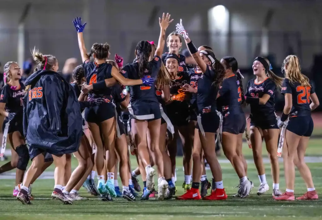 Huntington Beach players celebrate their 25-6 victory over Mater Dei...