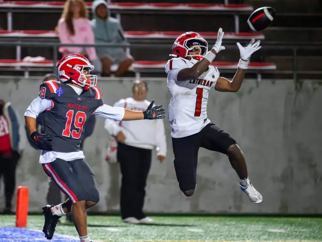 Orange Lutheran cornerback Anhor The Great Johnson jumps in front...