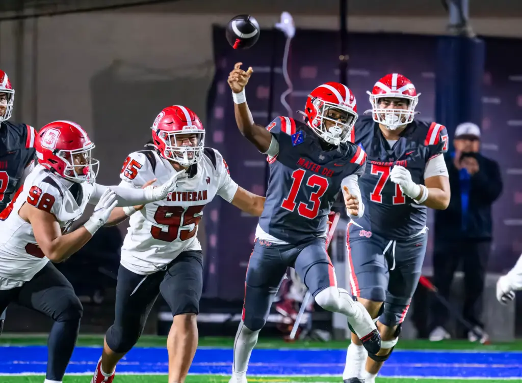 Mater Dei quarterback Paytyn Guess (13) makes the play action...