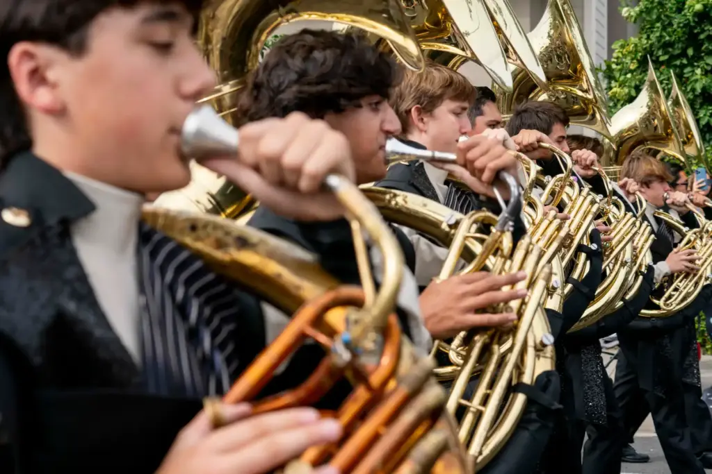 Sousaphonists from the El Dorado High School marching band march...