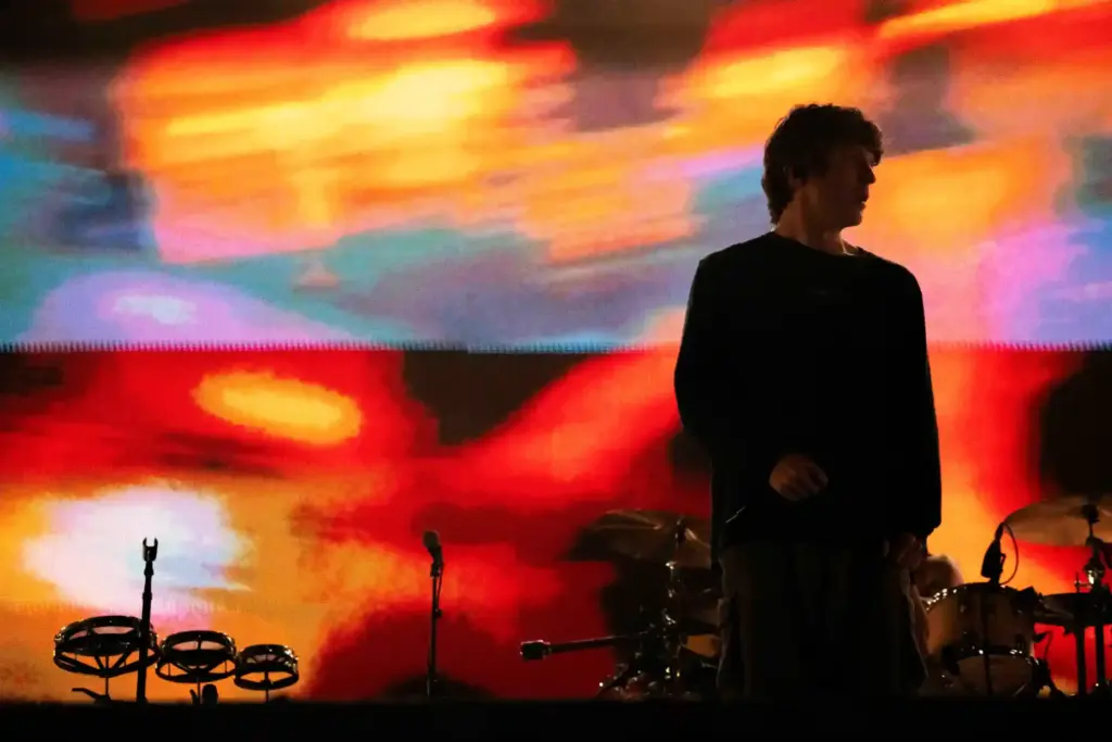 Brendan Yates, lead vocalist of Turnstile, looks out during a...