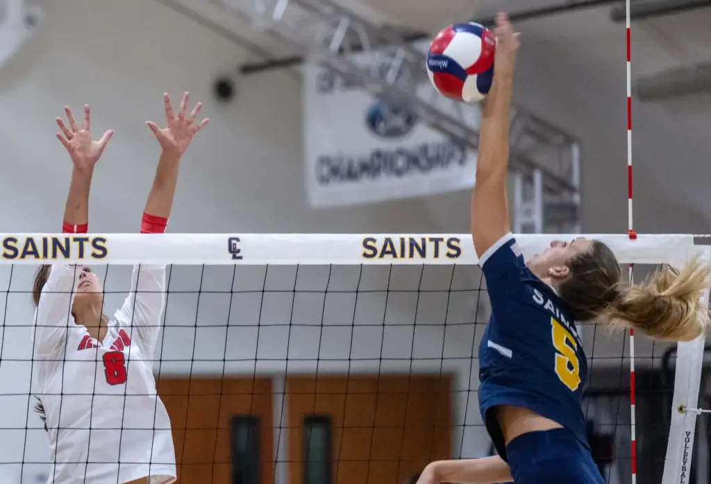 Crean Lutheran opposite hitter Brooke Badorek (5) hits the ball...
