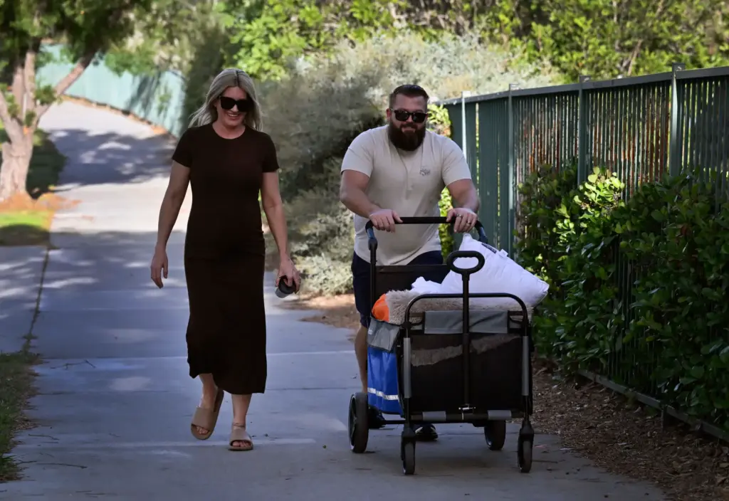 Brigitte Carter, left, 7 months pregnant, and husband David Carter...