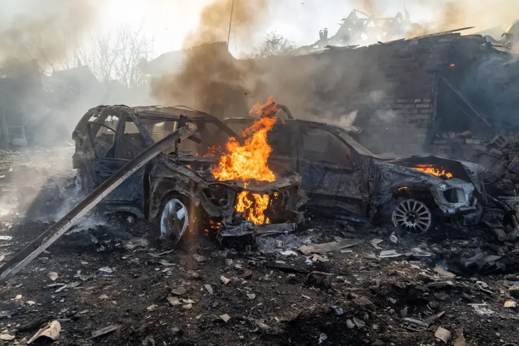 Cars burn after a Russian strike on a residential neighborhood in Kharkiv, Ukraine.