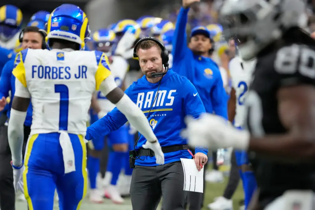 Rams head coach Sean McVay, center, greets cornerback Emmanuel Forbes...