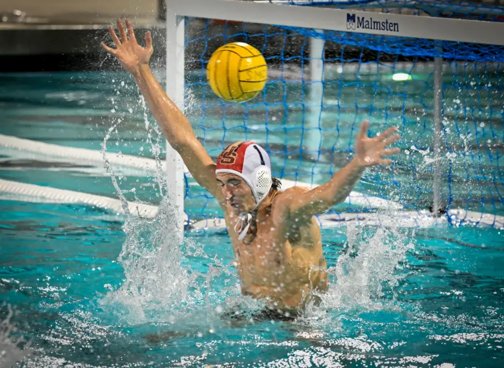 JSerraâs goalie Oliver Beck tries to block a shot by...