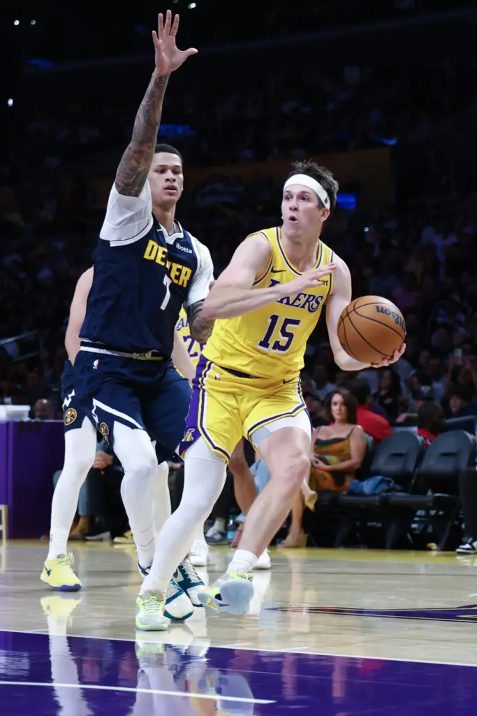 Lakers guard Austin Reaves drives to the basket during the...