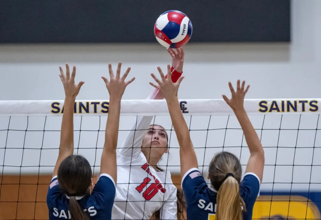 Redondo Union middle blocker Sienna Castillo (10) tips the ball...