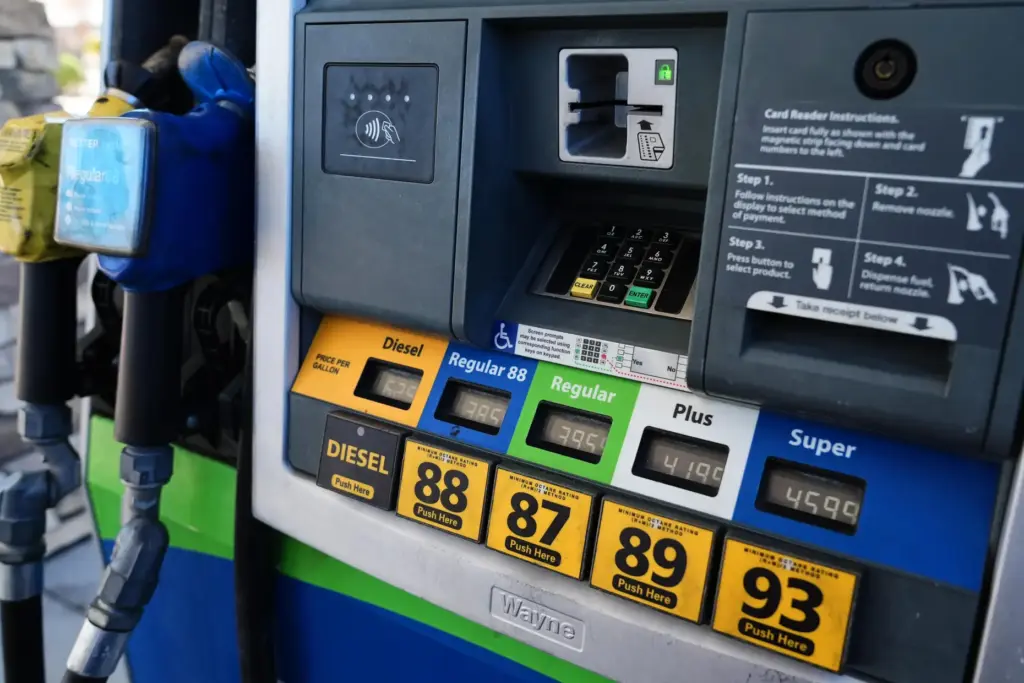 Fuel prices are displayed on the pump at a gas...