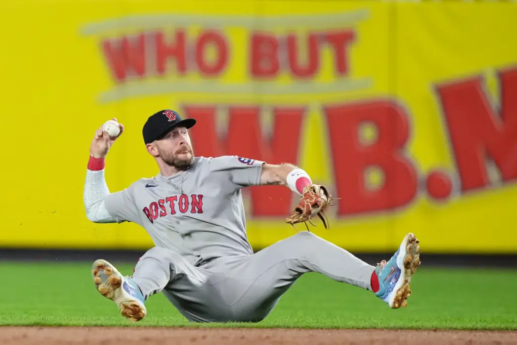 Boston Red Sox shortstop Trevor Story makes a throw to...