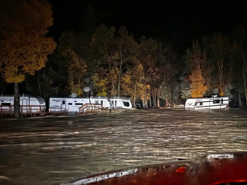 Floodwaters surround trailers at the Fun Valley Family Resort campground...