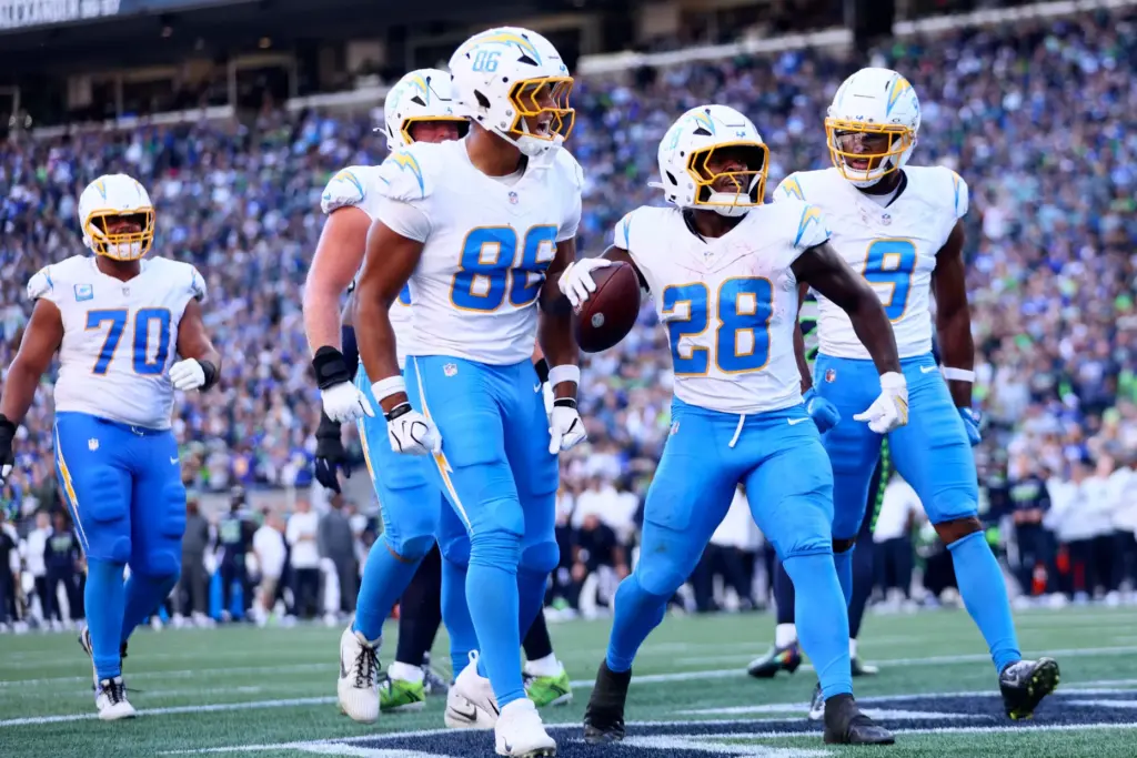 Chargers running back Kimani Vidal (28) celebrates after scoring a...