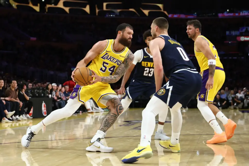 Lakers forward Sandro Mamukelashvili drives to the basket during the...