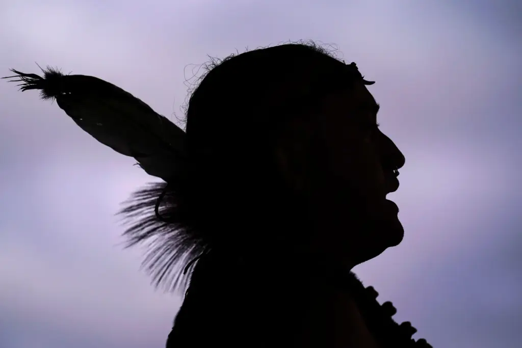 Tatanka Gibson of the Haliwa-Saponi/Nansemond Tribal Nations leads attendees in song and dance.