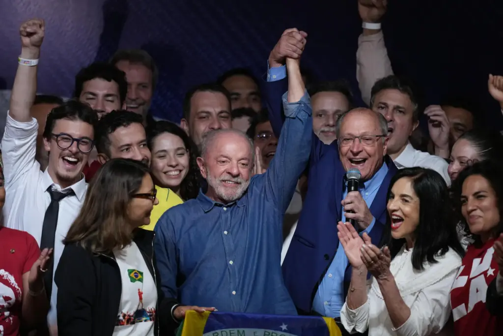 FILE – President Luiz Inacio Lula da Silva celebrates with...